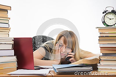 Tired student late at night talking on phone Stock Photo