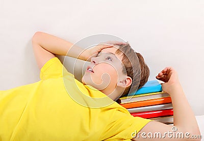 Tired Teenager with a Books Stock Photo