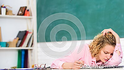 Tired tutor fall asleep at workplace. Tired student lean on desk. Exhausting lesson. Teacher exhausted after hard Stock Photo