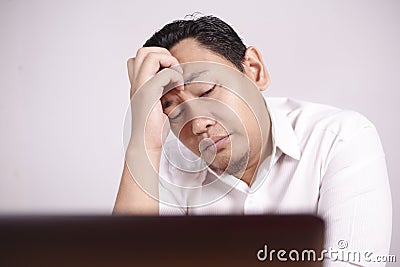 Tired Upset Man Working on Laptop , Bad Negative Emotion Stock Photo