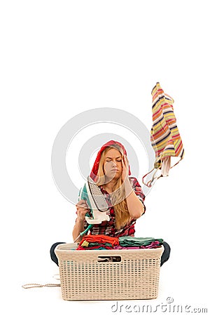 Tired woman with a basket of loundry annoyed with too much work Stock Photo
