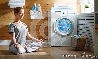 Tired woman housewife in stress meditates in lotus yoga pose in Stock Photo