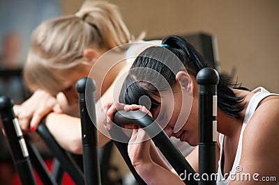 Tired women in gym Stock Photo