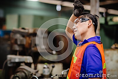 Tired worker, headache hot weather over heat unhealthy engineer working in heavy industry factory Stock Photo