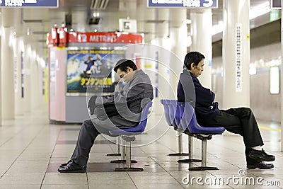 Tired workers in subway Editorial Stock Photo