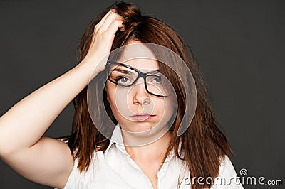 Tired young woman in glasses Stock Photo