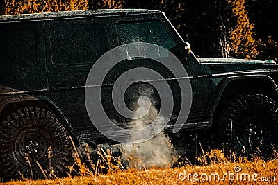 Tires in preparation for race. Off-road vehicle goes on the mountain. Mudding is off-roading through an area of wet mud Stock Photo