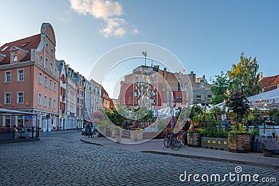 Tirgonu Street Small Square with restaurants in Riga Old Town - Riga, Latvia Editorial Stock Photo