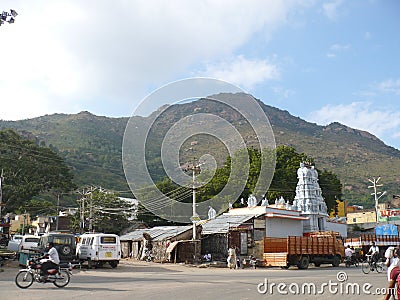 The ancient Hindu temple of Arunachaleswarar against the sacred hill of Mount Editorial Stock Photo