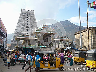 The ancient Hindu temple of Arunachaleswarar against the sacred hill of Mount Editorial Stock Photo