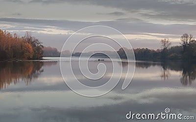 Tisa river,fisher boat in autumn november afternoon Stock Photo