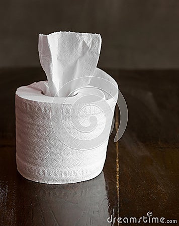 Tissue roll on table Stock Photo