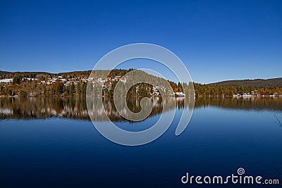 Titisee-Neustadt, Germany - 10 30 2012: surroundings of Titisee, scenic veiw of winter nature, forest and european village Editorial Stock Photo