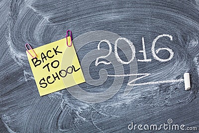 Title Back to school on piece of paper and title 2016 written by chalk on the chalkboard Stock Photo