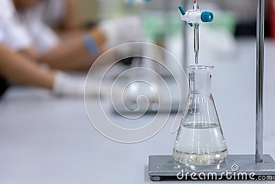 Titration technique in the laboratory. Stock Photo