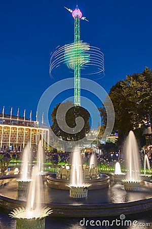 Tivoli amusement park in Copenhagen. Star flyer by night Editorial Stock Photo