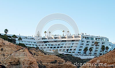 Tivoli Hotel building seen from the rocky beach, Carvoeiro, Portugal Editorial Stock Photo