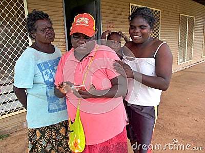 Tiwi Women and Baby Checking Phone Editorial Stock Photo