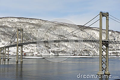 The Tjeldsund suspension road Bridge in winter crossing the Tjeldsundet strait, Troms county, Norway. Stock Photo
