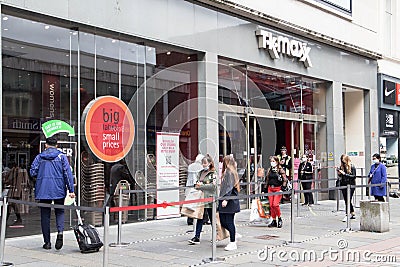 TK Max store shop entrance on shopping high street with queue of people outside Editorial Stock Photo