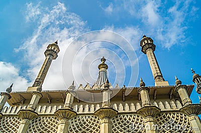 The striking spires of Brighton Pavilion against the backdrop of a bright blue sky. Stock Photo