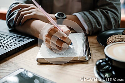 To do list, organize plans, projects, checklist, Productivity Works. Woman writing to do list. Close up of female hand Stock Photo