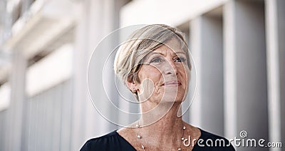 To go big youve got to make big moves. a mature businesswoman walking through the city. Stock Photo