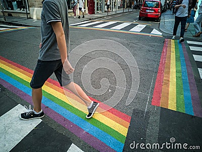 To prepare the gay pride in Paris pedestrian crosswalks were painted in the colors of the rainbow. Editorial Stock Photo