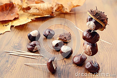 To tinker handmade figures of chestnuts and glue Stock Photo