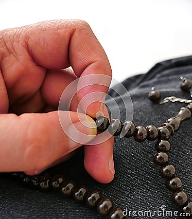 To worship with a hand, hand and rosary with a close-up rosary Stock Photo