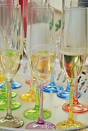 Coloured champagne glases prepare for a family party. Stock Photo