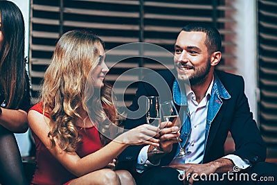 Toast Cheers. Beautiful young couple celebrating party event Stock Photo