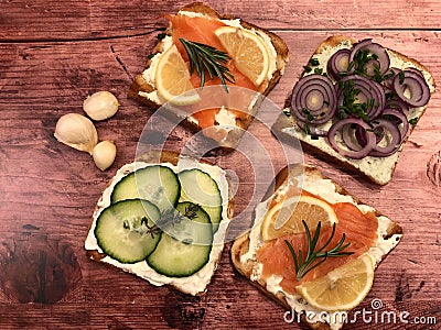 Toast sandwiches with smoked salmon, cream cheese and cucumber. Stock Photo