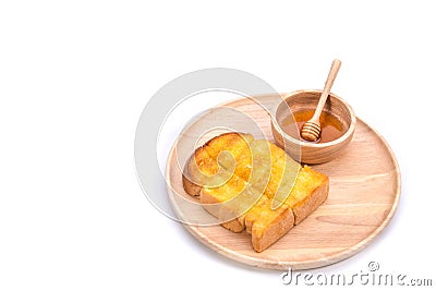 Toasted bread with honey and honey dipper on white background Stock Photo
