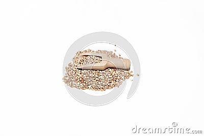Toasted buckwheat wooden spoon on buckwheat mound, gluten-free ancient grain for a healthy diet Stock Photo