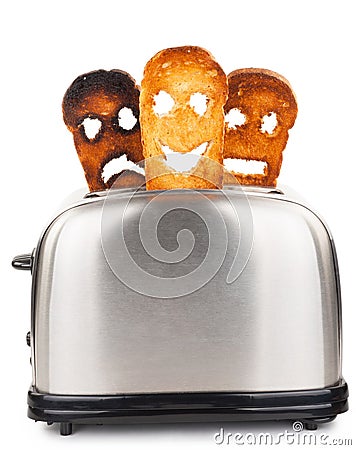 Toasts with smiley face in toaster Stock Photo