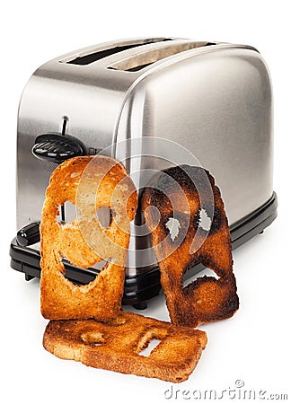 Toasts with smiley face in toaster Stock Photo