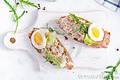 Italian bruschetta sandwiches with canned tuna, egg and cucumber. Stock Photo