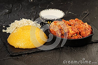 Tochitura is a traditional Romanian dish made from beef and pork served with polenta. Stock Photo