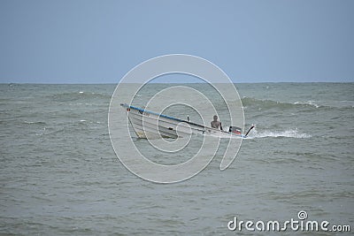 Fisherman Rides Fishing Pirogue in Saline Bay, Trinidad, West Indies Editorial Stock Photo
