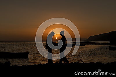 Two lovers at sunset by the sea,Karina,Soke,Aydin Stock Photo