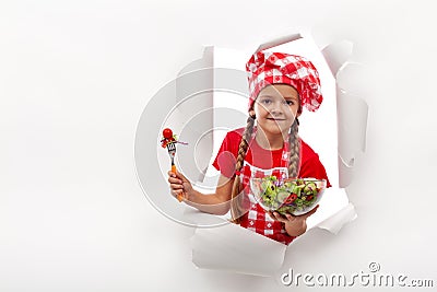 Todays menu - little girl presenting vegetable salad Stock Photo