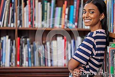 Todays studying plants the seeds for tomorrows exam success. a female standing in a library. Stock Photo