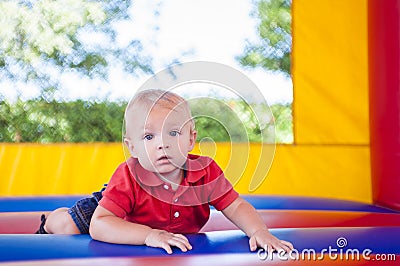 Toddler in Bounce House Stock Photo