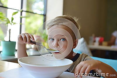 Toddler boy eating soup Stock Photo