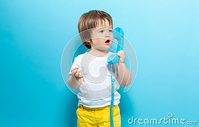 Toddler boy with an old fashioned phone Stock Photo
