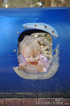 Toddler in a broken window Stock Photo