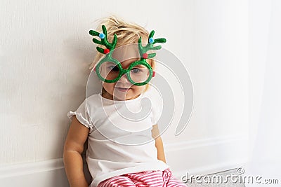 Toddler in christmas glasses Stock Photo