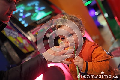 Toddler drinks fresh juice Stock Photo