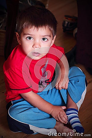 Toddler getting dressed Stock Photo